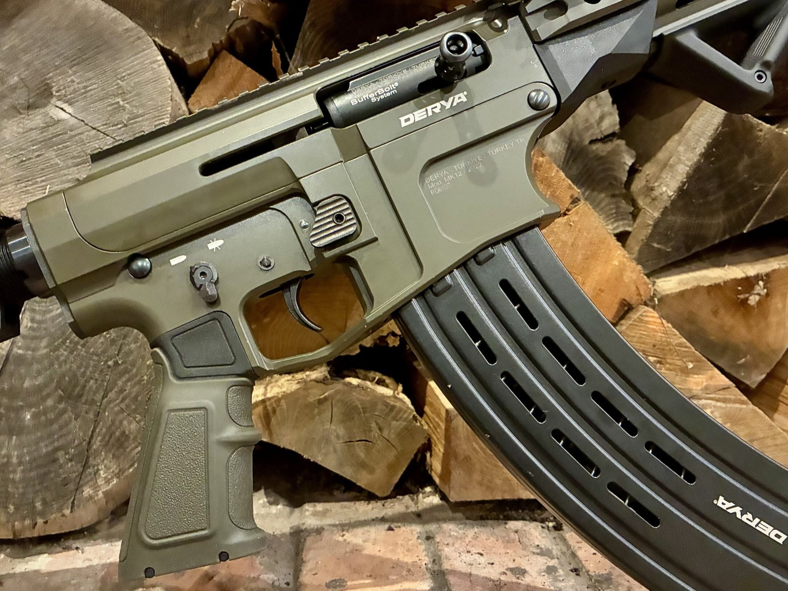 Close-up of the right side of a Derya Mk12 12G Semi-Automatic Section 1 (FAC) Shotgun in OD Green,