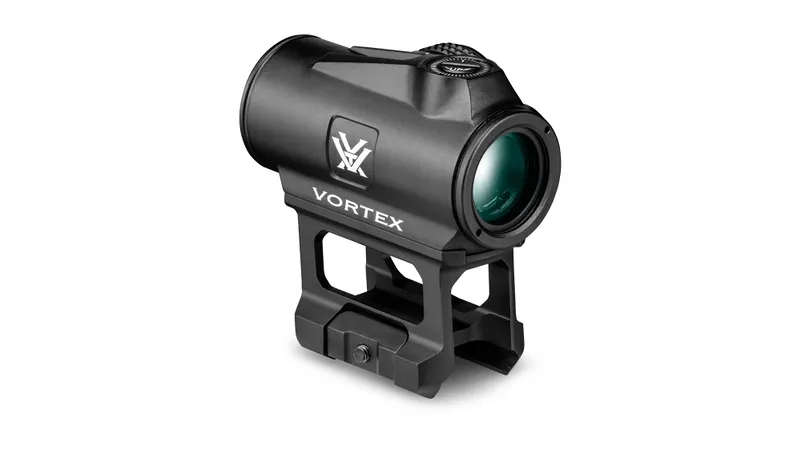 The Vortex Triumph 2MOA Red Dot, featuring the Vortex logo, is shown mounted on a raised Picatinny rail mount against a white background.
