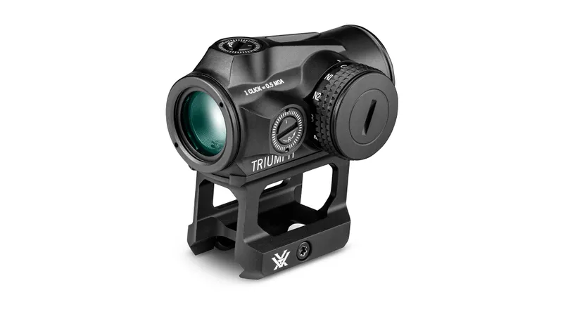 A Vortex Triumph 2MOA Red Dot in black, mounted on a riser base with adjustment dials and branding, seen at an angle against a white background.