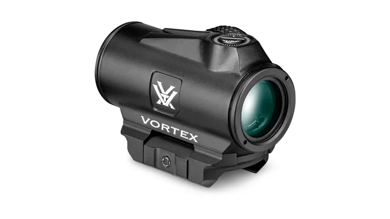 The Vortex Triumph 2MOA Red Dot is a black sight scope with a cylindrical body, adjustment knob, green-tinted lens, and displays the Vortex logo and brand name on the side.