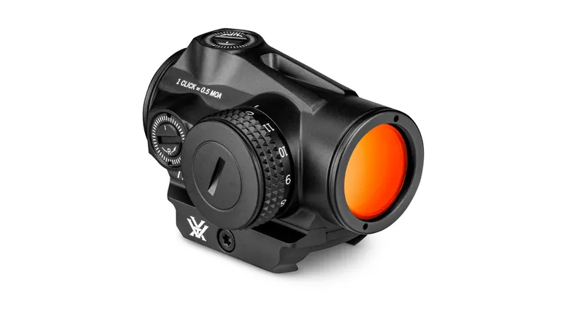 The Vortex Triumph 2MOA Red Dot features adjustment dials and a red-tinted lens, shown in black against a white background.