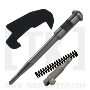 Components of the Volquartsen Essential Upgrade & Maintenance Kit for the Smith & Wesson M&P 15-22, including a metallic firing pin, a coil spring, a small metal part, and a flat black plate.