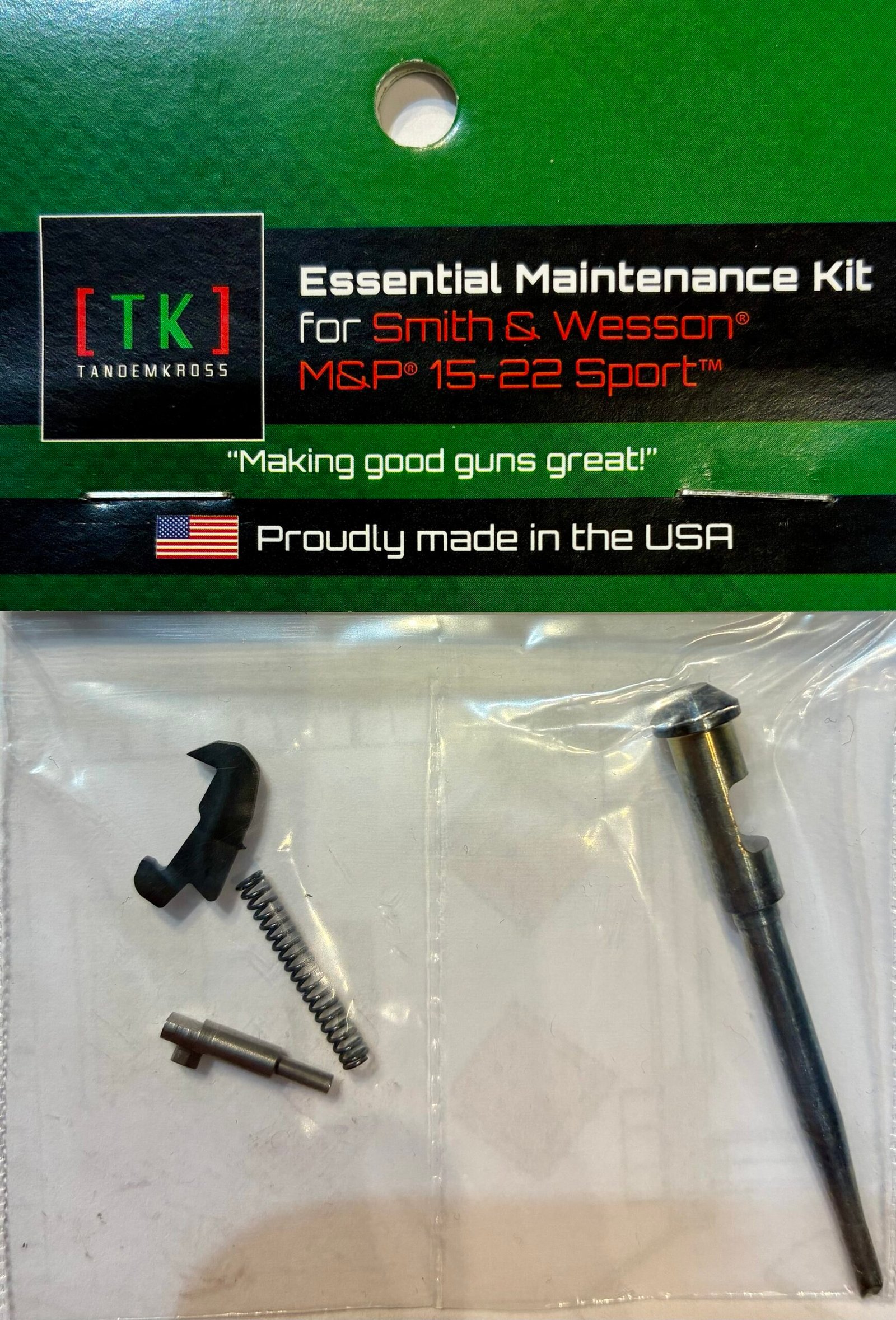 Tandemkross Essential Upgrade & Maintenance Kit for the Smith & Wesson M&P 15-22 featuring a metal firing pin, coil spring, small pin, and shaped lever in a clear plastic bag attached to a green display card.